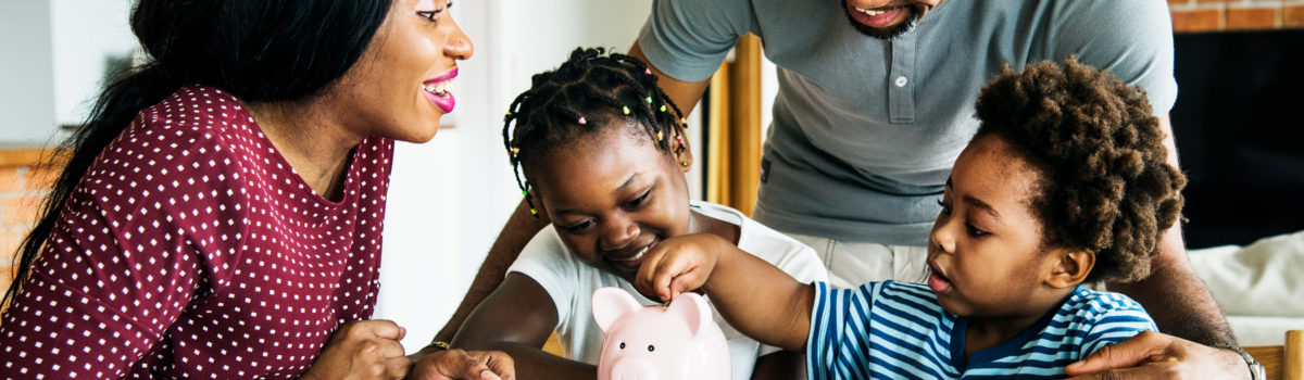 Family with piggy bank starting savings