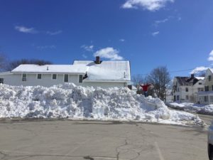 Snow plie outside the Dirigo Drive branch.